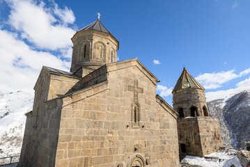 Fototapeta premium Gergeti Trinity Church near the village of Stepantsminda, popular tourist destination in the Caucasus in Georgia