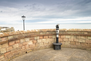 Tourist Telescope looking out to sea at Bamburgh castle Northumberland, England, UK (May 2017)