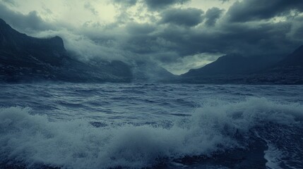 A dramatic seascape showing a stormy ocean against mountain ranges