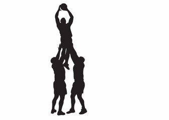Teamwork elevates a basketball player to score a dramatic winning shot, a powerful black and white silhouette.