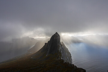 Stunning autumn landscape of Segla Mountain in Senja Island, Northern Norway, with dramatic cliffs and fjords.