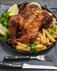 whole crispy skin roasted chicken on a platter