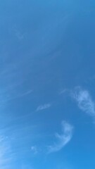 The sky was cloudless, bright blue, like clear water