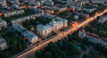 Obraz premium Aerial View of City at Night with Long Exposure Car Lights
