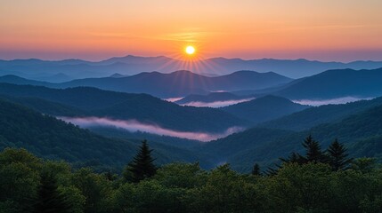 Sunrise over misty mountain range