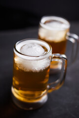 mug of beer on wooden table.