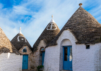 wonderful white mediterranean architecture of italian buildings with sdtrange conic roofs and wfite...