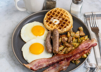 fried eggs with waffles  top with melted butter and  syrup
