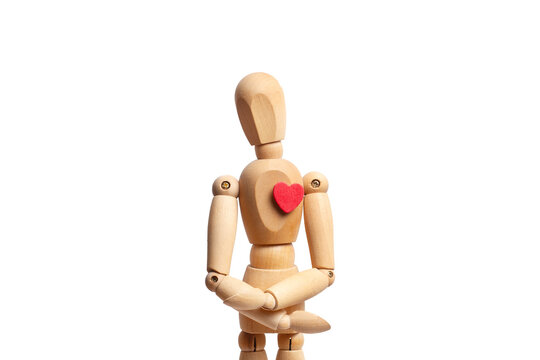 A wooden mannequin toy with a red heart on his chest isolated on white background - Powered by Adobe