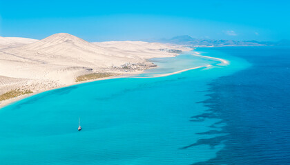 Stunning high aspect aerial panoramic view of the beautiful tropical looking beach, lagoon and sand dunes at Sotavento Risco del Paso beach near Costa Calma on Fuerteventura Canary Islands Spain