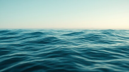 Obraz premium Calming ocean water surface with gentle waves and a light sky