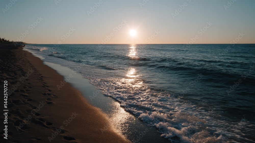 Aufkleber golden rays stretch across the calm ocean as the sun sets over a peaceful beach, creating a tranquil