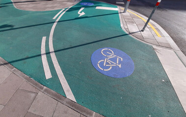 picturesque green bike path with blue sign in Vienna