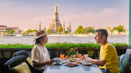 Serene breakfast by the river with stunning views of Wat Arun in Bangkok