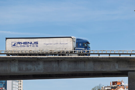 Rhenus logistics truck crossing a bridge in the city
