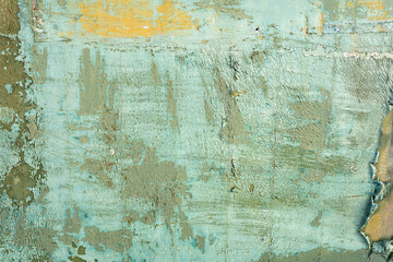 Peeling green paint on rusty metal surface grunge texture top view background. Cracked green paint...
