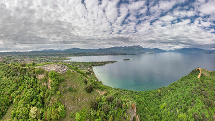 Panoramic aerial view of Rocca di Manerba on Lake Garda Lombardy Italy. the image transmits serenity while waiting for the much more crowded and hot summer season