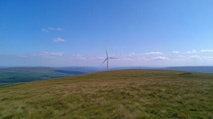 Renewable Energy, Wind Turbine on Grassy Hill with Clear Blue Sky
