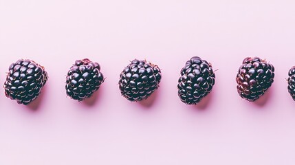 Flat lay photo with blackberries on a bright background. Juicy and vibrant composition ideal for healthy food, summer, and organic lifestyle themes.