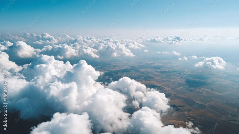 Leinwandbilder cumulus clouds float above patchwork farmland, casting soft shadows on fields during the golden hour