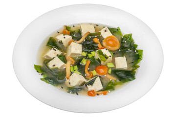 Soup with tofu and vegetables. Isolated over white background.