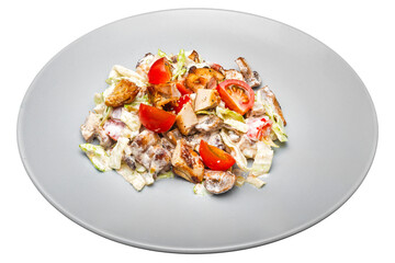 Salad with chicken and vegetables on a plate. Isolated over white background