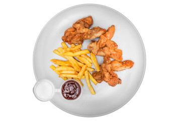 Fried chicken wings with french fries and ketchup. Isolated over white background