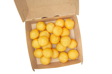 Deep-fried doughnuts in a paper box isolated on white background