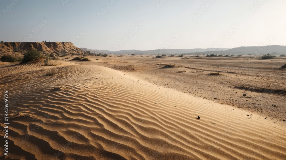 Aufkleber Natural dunes showcase intricate wave patterns in golden sand under sunset light, creating a tranquil atmosphere with ample room for creative text elements