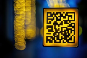 QR Code Displayed Against a Vivid Bokeh Background at Night