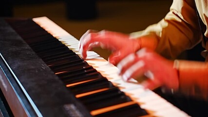 Musical performance with skilled pianist playing keys in a warm setting