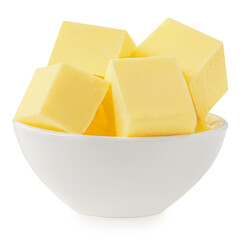 Butter cubes isolated on white background. Fresh cow’s milk butter pieces in a white  bowl close up. Cooking Package design element..
