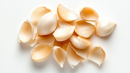 Numerous peeled garlic cloves arranged elegantly on a light background, showcasing their creamy color and smooth texture, perfect for culinary art or health purposes.