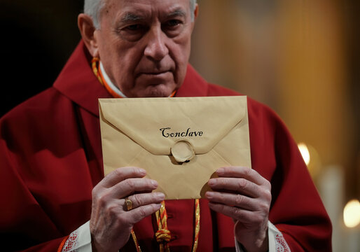 Senior cardinal holding sealed conclave envelope with reverent hands in warm candlelit setting during papal election