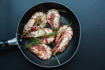 Sea giant shrimp grilled in black pan with vegetable spicy seafood grilled