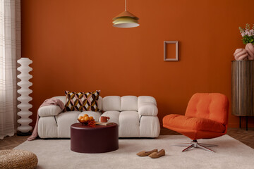 Warm modern living room with burnt orange walls, soft white sofa, and retro swivel chair. Bold colors meet cozy comfort. Stylish home decor.