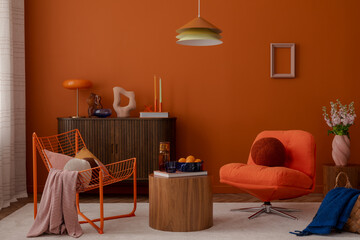 Eclectic living room with modern wire chair, orange tones, and soft furnishings. A warm and vibrant...