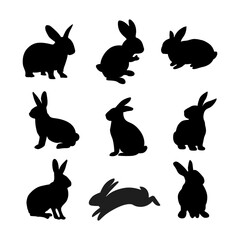 Set of rabbits silhouette in different poses. Hand drawn black silhouettes of easter bunnies isolated on white background. Vector illustration elements design.