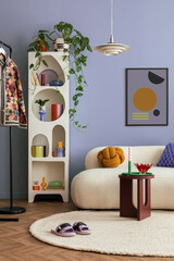 Interior desgin of modern living room interior with mock up poster frame, colorful decorations and accessories, plants, sofa, coffee table. Blue wall. Home decor. Template