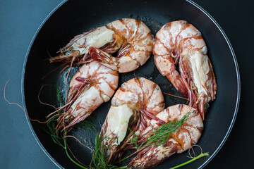Sea giant shrimp grilled in black pan with vegetable spicy seafood grilled
