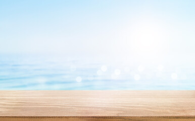 summer seascape background with wooden table in foreground