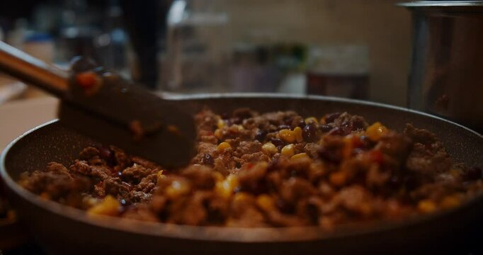 A chef showcases how to prepare a delicious chili in this video