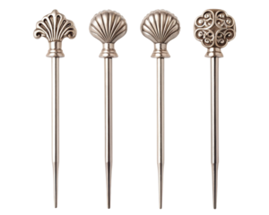 Decorative metal cocktail picks with elegant vintage designs for serving on a transparent background