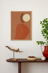 Stylish and minimalist composition on wooden design commode with mock up poster frame, flowers in...