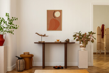Cozy and stylish interior of living room with mock up poster frame, wooden console, flowers in vase, decorations and personal accessories. Modern home decor. Template.