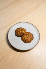 A plate of two cookies.