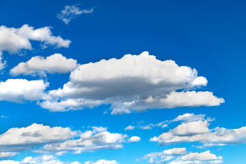 white clouds against the blue sky.