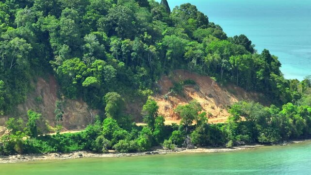 This aerial perspective captures the destructive effects of deforestation. The land, once covered in trees, now bare, is a major contributor to global warming, leading to climate disruptions.
