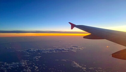 Fototapeta premium View from airplane window to sunset.