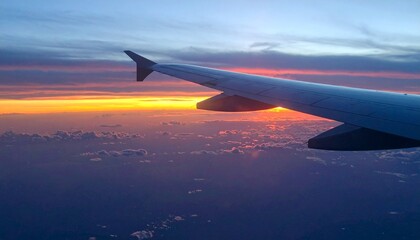 Fototapeta premium View from airplane window to sunset.